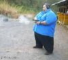 1236337872_fat_guy_shooting_his_gun_0.jpg
