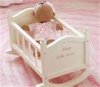doll in cradle.jpg