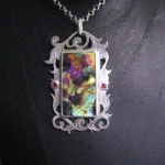 Spectrolite Scrollowrk reversible pendant with Pink sapphire accents side 1