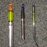 left to right
1.A "Megalodon" from Jason at elctronicstix.com.. That I use all day,even at work doing construction work..Best PV for the hard working man. No finish and all Mechanical So there is very little that could go wrong with that.And a Mechanical repair is something any working Man can handle.
The Don is sporting an unused dct tank with a cherry vapes ming tip. 

2.An ego-c Sporting a 510 LR bridgless atty with a Cherry vapes Purple Pawn tip.

3.And last a 5v pass through sporting a 2.4 ohm xl fluximizer.Helps save battery usage and wear and tear.Currently I try to use this passthrough at my computer while at home .