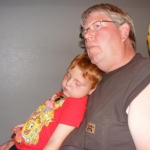 My husband and grandson, watching the video at Crazy Horse Monument.  The grandson had a long day and the video didn't have a lot of action.