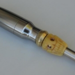 torch mod, works like a champ although I found having the button on the bottom makes for a sore pinky, uses a tire valve connector fit inside a brass fitting I poor man milled to be press(hammered) into the body.  Skull is cow (I hope)
bone, bought from a swapmeet in phoenix back in the early 80's....ahhh, good times, good times.....