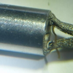 Assembled with wick material under metal mesh