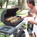 Mark & Robert .. rustling up mid-afternoon snacks on the grill.  The rest of the day is usually devoted to sucking down a case or two of ice-cold Coronas. -- and of course...some serious ping-pong!