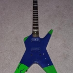 Old Dean model guitar that I stripped down and repainted.  I'm currently saving for some EMG pickups and some new tuning pegs (plus new pots, switches, etc) to get this bad boy in playing shape.  Interesting paint job, huh?