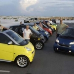 Mine is the blue cabrio on the right.  The very tall man leaning on my car is not me!  I'm kneeling on the driver's seat.