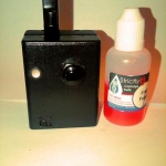 The Puck next to a 30ml Bottle of juice.