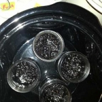 Jars of tobacco in VG in the crock, with the lids off after 1 day of brewing...