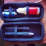 e cig case! With my Manual 1000Mah Tornado Battery, My automatic battery. Titan 20ml 18 MG Redbull Flavor. Drip Tip, and DCT tank :)