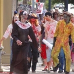 Alamo Drafthouse- Zombie Walk '07 or '08. (Bad with dates)
I'm right behind the zombie in the bright yellow jumpsuit. I'm holding a free poster, haha.