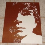 Portrait of my boyfriend. Done by cutting out the positive space in his face.