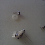 Rewiring and wicking.. I used one toothpick, snips and wrapped the wire 6 times around.. used an old threader for sewing and pulled the butcher's twine thru the coil.. I left it a bit long..