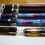 Three wrapped 650 Twist Bats and one black wrapped EVOD tank. 
In front are a 'clear EVOD-C' and a Fast Tech T32 clearomizer.