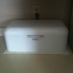 charging station:  polder brand stainless steel breadbox.  got mine on amazon.  they come in a variety of colors.