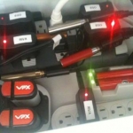 charging station 3:  some of the stuff i've fit in it.  i used a large surge protector and a small surge protector.  i have three eGo chargers, 2 riva 510 chargers, a black and decker vpx powerpak charger and the charger for the provari shown.  i have room for at least one more provari sized battery charger, and a couple of more smaller chargers.  sometimes i also charge my iphone here.