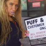 Vape in front of a smoke shop