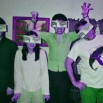 me & my family, back when i had hair. (& my now shaven headed son did too!) the masks were a gift from my friend in New Zealand. :-D