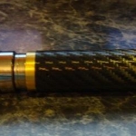 Atomo clone covered with a black carbon fiber skin. The topper is a Vivi Nova Champion which is skinned to match.