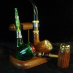 Pipe Love - the Belovgd (looks like a typo, but that's how FT spells it!) is green marble acrylic. This photo doesn't do it justice. The 618 is wood grain and there is no button to push. It's an automatic and soooo nice to vape. The Smoktek Guardian is genuine wood. Thanks Terry!!