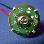 The board ready to go in. I cut the Neg. circuit to the center, as you can see at the 3 o'clock position.