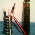 Several 510's with XL Tanks, one 510 with a Sapphire tank,  homemade ecig stand.  Silver Bullet with Liquinator.