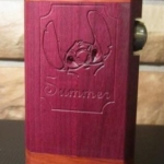 RSM Cutlass 5.1 with custom engraving. Purpleheart panels and Redheart end caps.