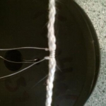Crimped Wire around Rope Wick