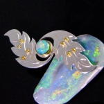 crystal opal brooch in siver and 22k gold.
