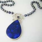 Blue Andamooka Gem Matrix Opal with natural black pearls.