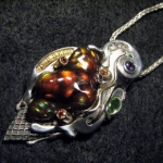 Ice Cream in the Fall~ Hand Carved Fire Agate with various faceted gem accents, 22 gold wire-wrapped accents...100% hand faricated.