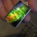 Ammolite Inlay with Sapphire cap.