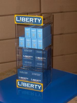 Acrylic retail display unit for starter kits and cartons/packs of cartridges.