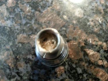 At this point, I added some eliquid. It allowed me to push the wicks down into the chimney tube, but not "stuffed," which could block juice flow. Also, remember to keep the coil above the air flow chamber.