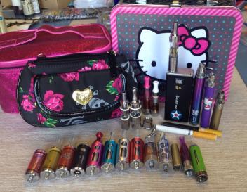 Collection has grown quite a bit, but there *might* have been even more updating after this. The pink train case & HK lunchbox are full of juice and the little rose clutch is where I stash all my batteries and tanks.