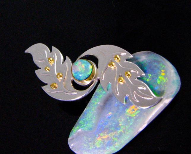crystal opal brooch in siver and 22k gold.