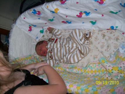 Gavin and part of Emily the day we brought him home