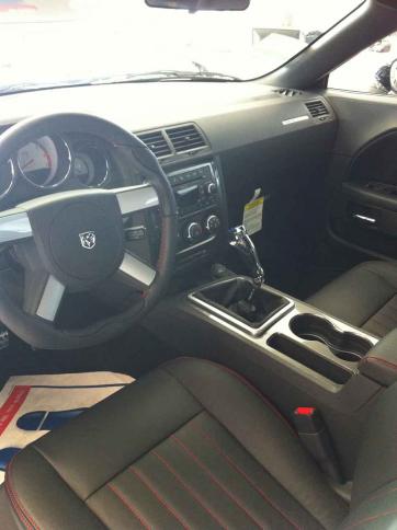 Hurst shifter with a short throw, MOPAR carbon fiber handle.