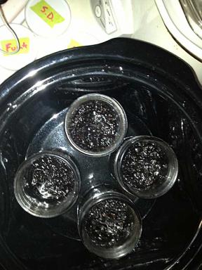 Jars of tobacco in VG in the crock, with the lids off after 1 day of brewing...