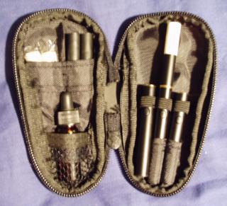 Joye 510 (Yeti/Dura/Titan) in Casemaster Super Bee Dart Case

Top left: two new white cartridges in cellophane, two black atomizers with cartridges.

Bottom left: 4ml Johnson Creek glass sample bottle (about 2-1/2"H x 1/2"W). Two 3ml plastic bottles (about 1-7/8"H x 1/2"W) also fit. A 5ml PureSmoker plastic sample bottle (about 2-1/8"H x 7/8"W) will fit, but bulges the outside of the case slightly when closed.

Right: Assembled 510 with long manual battery and white cartridge, surrounded by two short manual batteries. Can fit three assembled 510's with long batteries. The bottom left pouch is too tight for a battery, but it doesn't really matter.

The closed case is about 5-1/4"H x 2-7/8"W x 1"D. A pack of 100mm analog cigarettes is 4"H x 2-1/8"W x 7/8"D.

I bought mine on eBay for around $10 with shipping.
