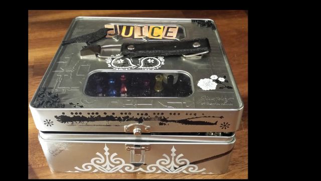 juice box closed - this is my desktop juicebox... has metal dividers so I can put my sample bottles and the tank I put it in in it's own compartment... I rotate all of these about every 2 weeks with new flavors and keep my top 5 on the front row.  Box is the Tim Holtz alcohol ink storage box available on LOTS of craft websites.  My is just altered a wee bit on the outside b/c thats how I like it.