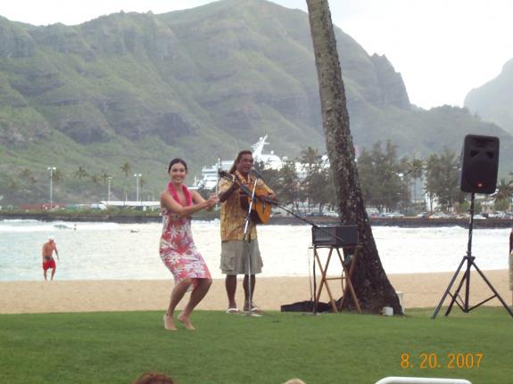 Kauai-07  Beachside Hula entertainment.  She sure looked like a natural to me.  I had such a huge desire to ask if she'd be willing to come to Texas an' ride my pony. --
...... Oh well....!