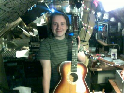 Me holding a guitar