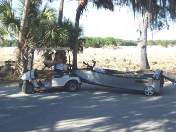 Me pulling the portabote with the golf cart.