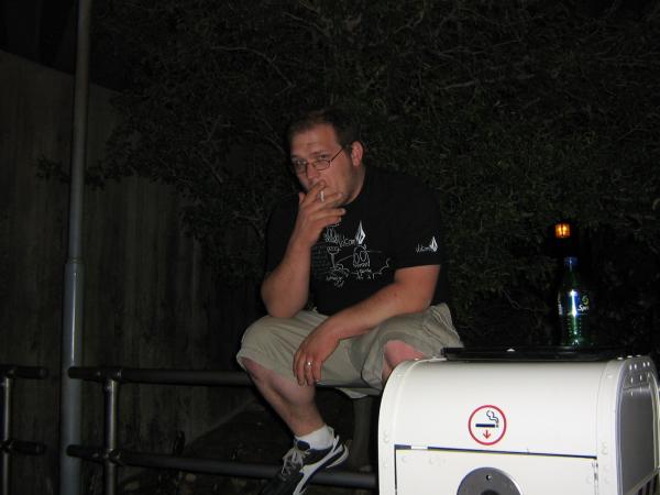 Me smoking at disneys california adventure park, confined to the smoking area with my analogs