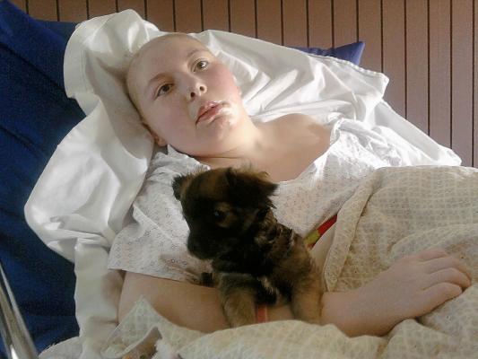 Meg's home from the hospital (finally) and has a new puppy!!!