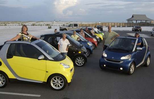 Mine is the blue cabrio on the right.  The very tall man leaning on my car is not me!  I'm kneeling on the driver's seat.