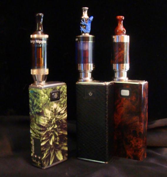 MVPs - two with 510 connections and one with an 808 connection from Smokeless Image. All skinned. Two topped with Vivi Nova Champions and the leftmost has an 808 Aspire tank from Smokeless Image.