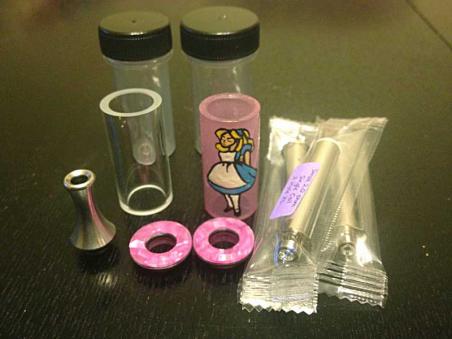 My new "Alice" tank and caps (and a spare clear tank an a stainless steel drip tip) from IBTanked. This tank is truly a work of art, and will ONLY b filled with juices from AiV...