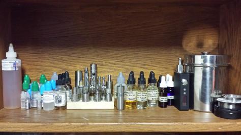 My Vape Shelf, where I keep all my juice, cotton, wire, and most of my mods. I have two Nemesis clones that aren't on my shelf and one ego that stays in use most the time and does not have a slot on the stand.
