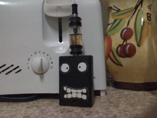 My VMU PV (TTTELiquids.com) with the MAP Tank mod (CloudsOfVapor.com) filled with Freedom Juice (HaloCigs.com), a shorty 510 Delrin plastic drip tip (ElectroNicStix.com), two protected 14500 Trustfire batteries (MadVapes.com), and inanimate character stickers (ThinkGeek.com).